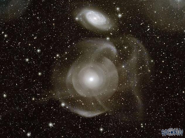 NGC 474 ir elipsveida... Autors: Fosilija Gaismas gadu tālumā.